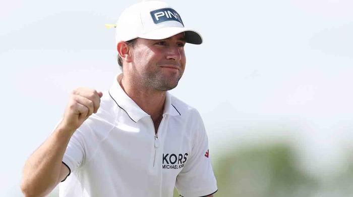 Austin Eckroat celebrates on the 18th green on his way to winning the 2024 Cognizant Classic in The Palm Beaches at PGA National Resort in Palm Beach Gardens, Fla.